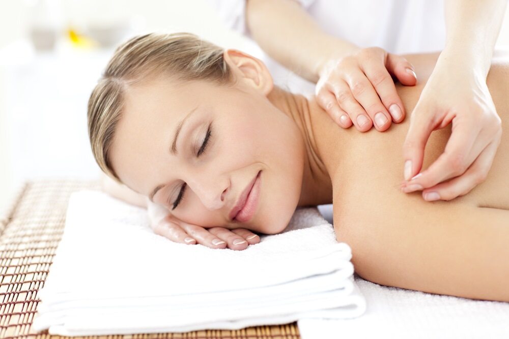 Relaxed woman receiving shoulder acupuncture treatment Relaxed woman receiving shoulder acupuncture treatment